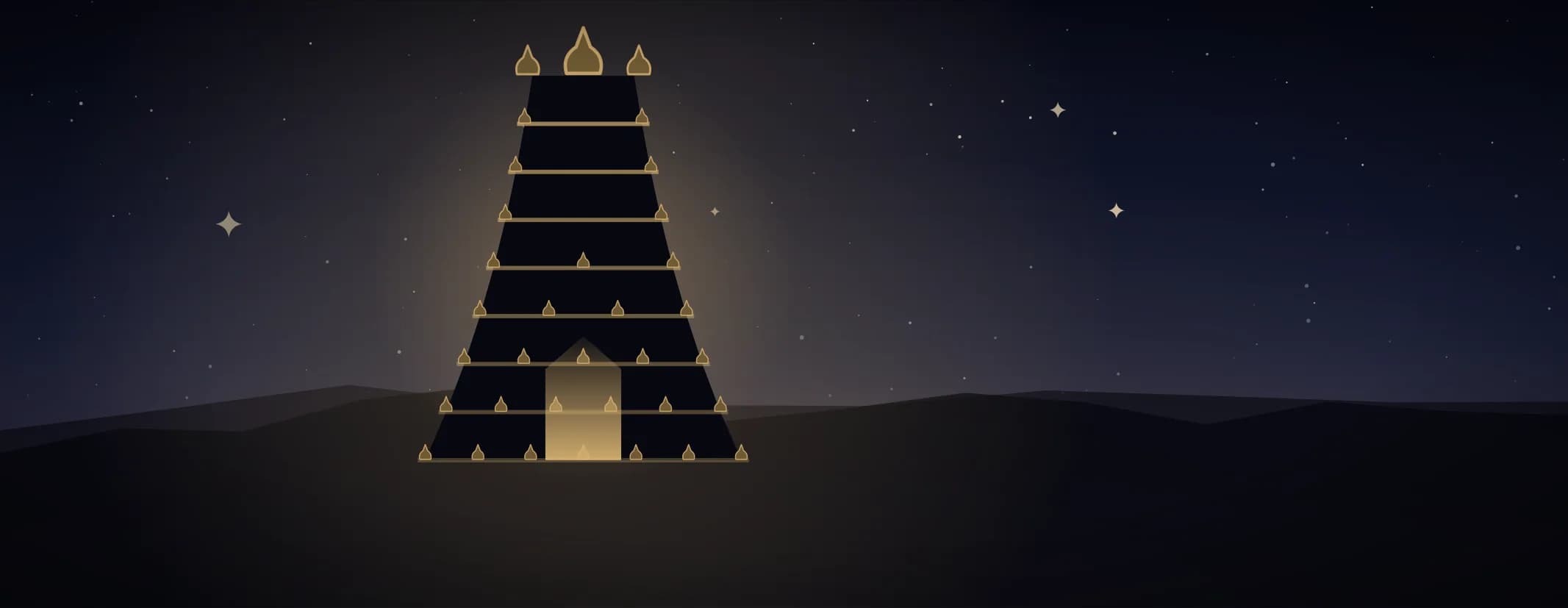 A tiered temple gopuram in silhouette with brass finials along every tier and its doorway lit, under a deep indigo sky, the subject set well to the left of the frame.
