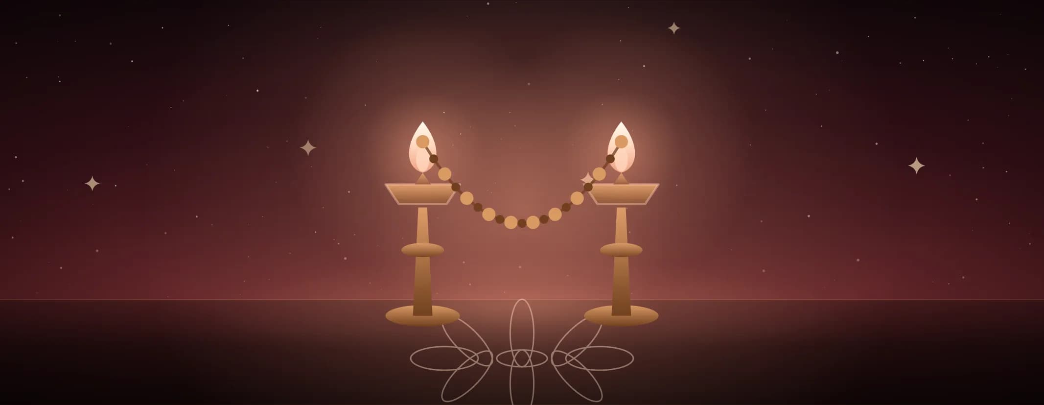 Two brass lamps both lit, a beaded garland slung in a curve between them over a kolam floor, in warm red light, the subject set well to the left of the frame, drawn for this page's elements band.