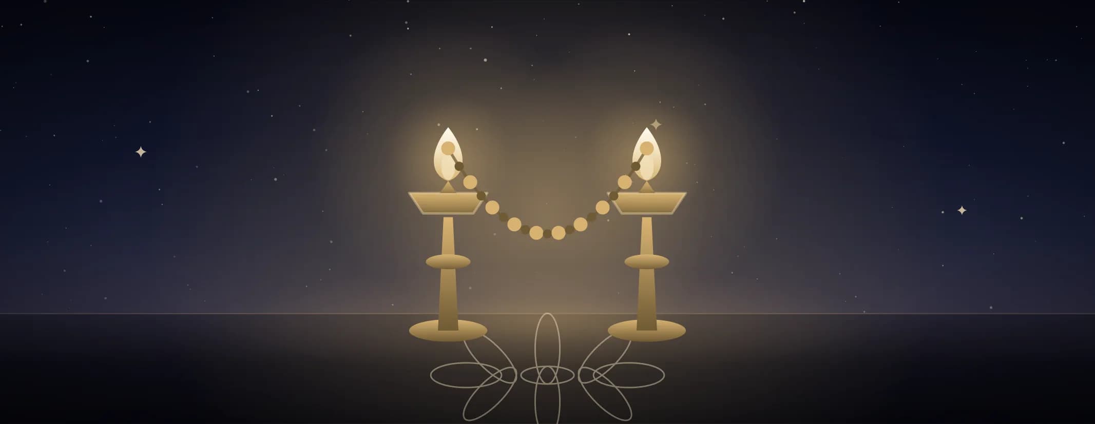 Two brass lamps both lit, a beaded garland slung in a curve between them over a kolam floor, under a deep indigo sky, the subject set well to the left of the frame.